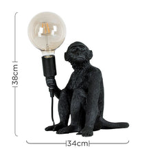 Load image into Gallery viewer, Table Lamp / Light, Sitting Monkey, Table Lamp Holding a Bulb, Black.

